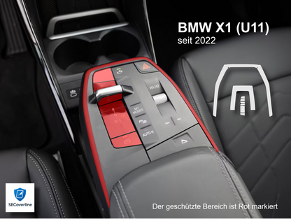 alt="BMW X1 Mittelkonsole foliert mit matter oder glänzender Schutzfolie gegen Fingerabdrücke und Reflexionen"